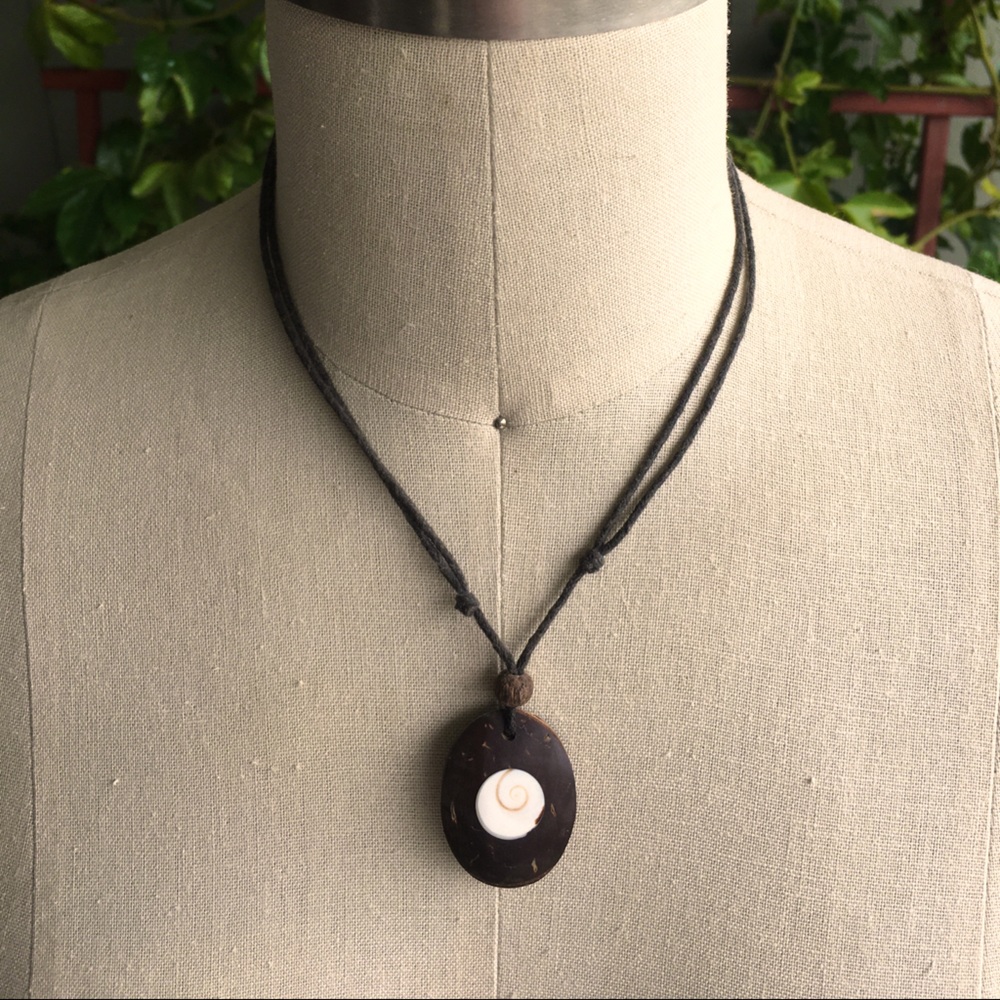 Coconut pendant with inserted Shell.